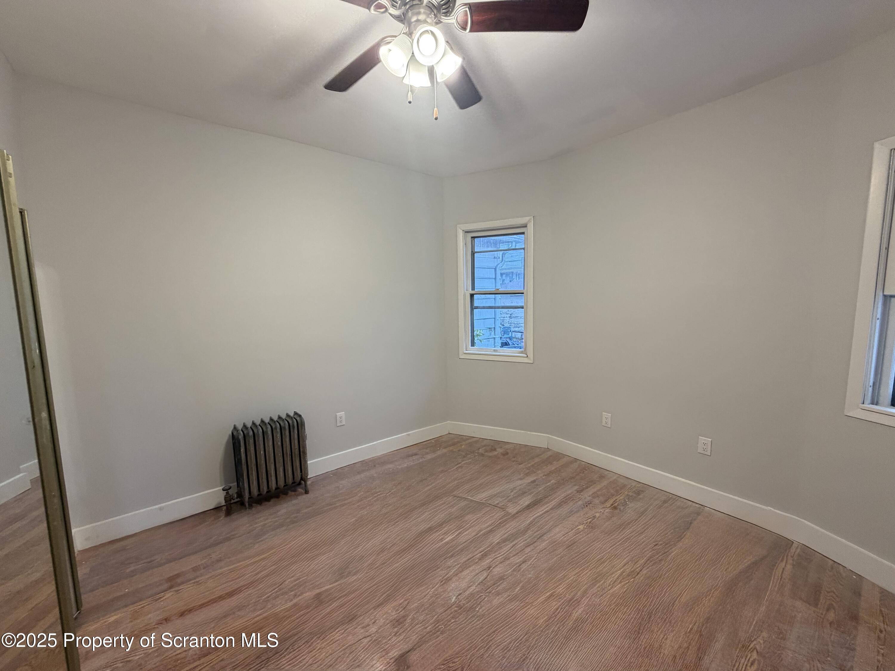 2105 Belmont Terrace, Unit 1 Scranton, PA 18508 - Photo 15 of 16 wooden floor in an empty room with a window