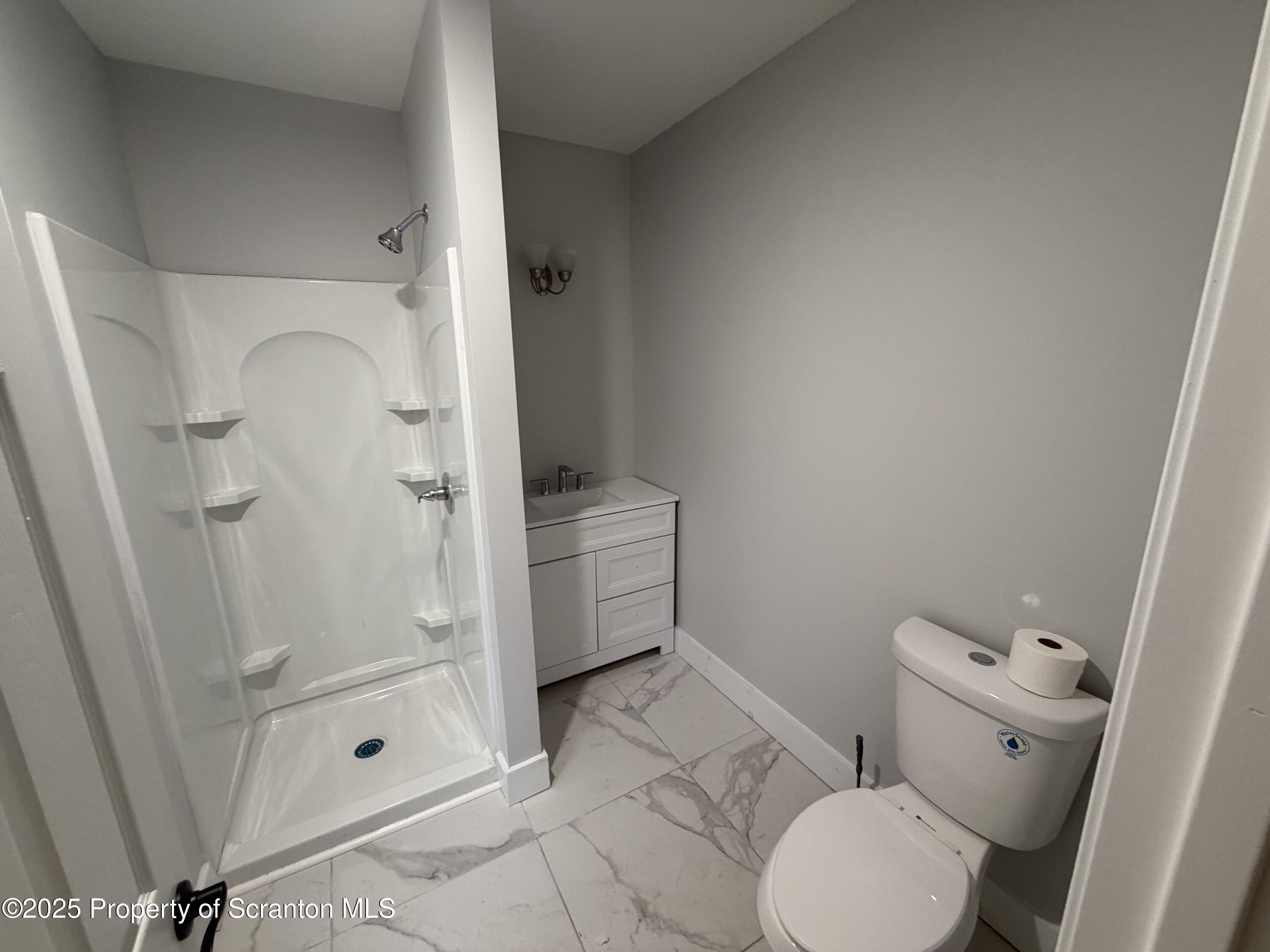 2105 Belmont Terrace, Unit 1 Scranton, PA 18508 - Photo 16 of 16 a bathroom with a toilet and a shower