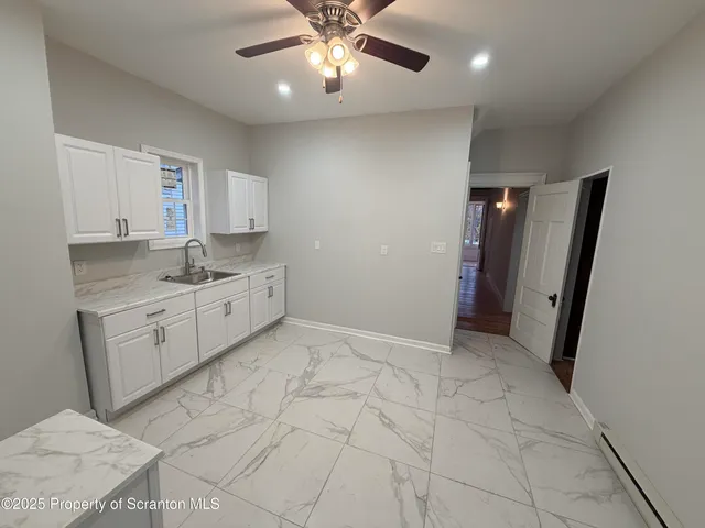 a view of a kitchen with a sink and dishwasher