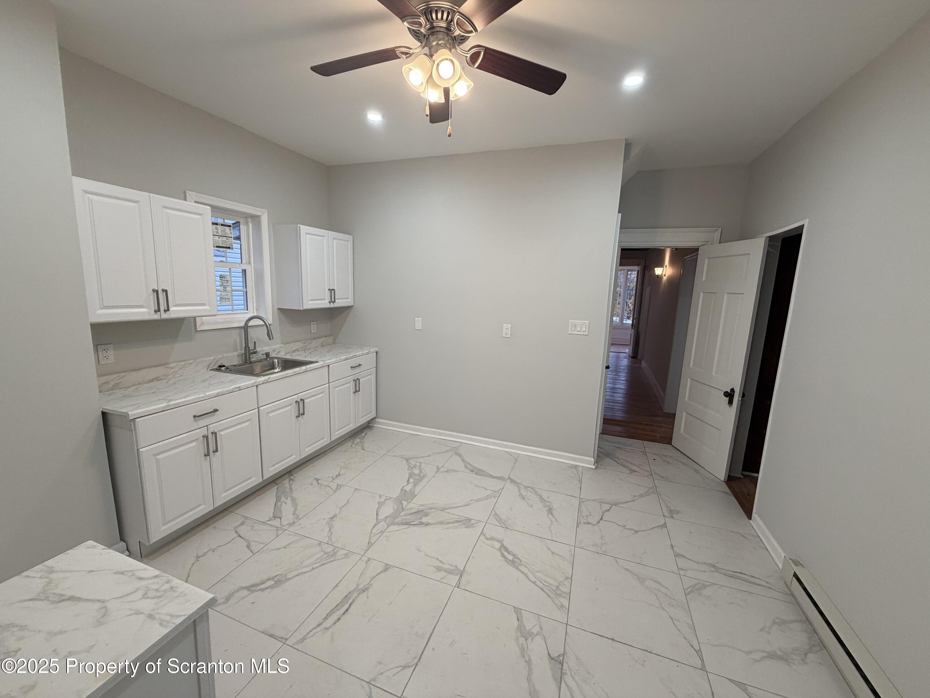 2105 Belmont Terrace, Unit 1 Scranton, PA 18508 - Photo 7 of 16 a view of a kitchen with a sink and dishwasher