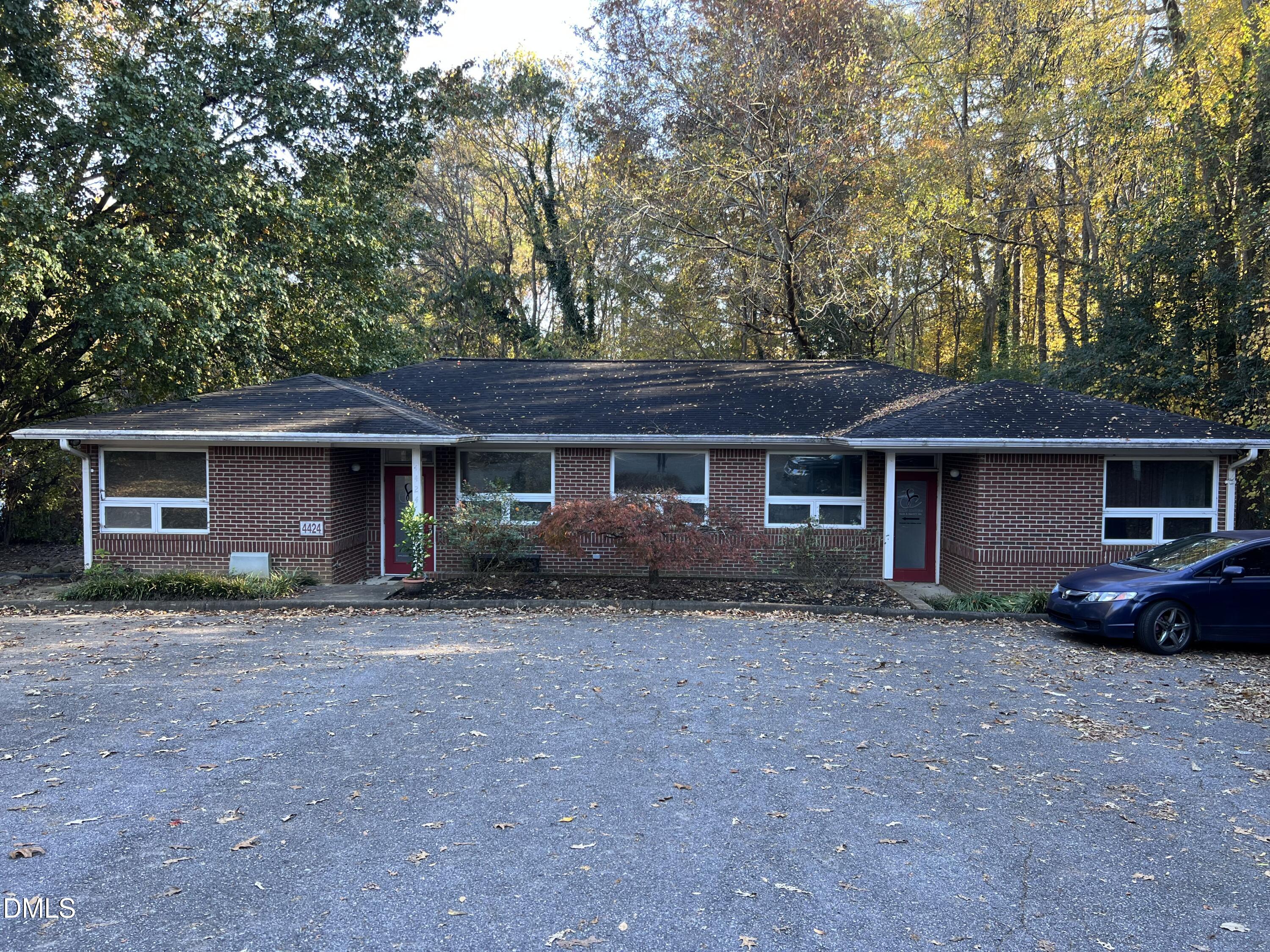4424 Louisburg Road Raleigh, NC 27616 - Photo 5 of 17 a view of a house with a yard and large tree