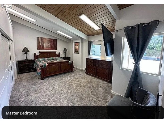 94475 Golf Course Lane North Bend, OR 97459 - Photo 14 of 45 a living room with furniture and a flat screen tv