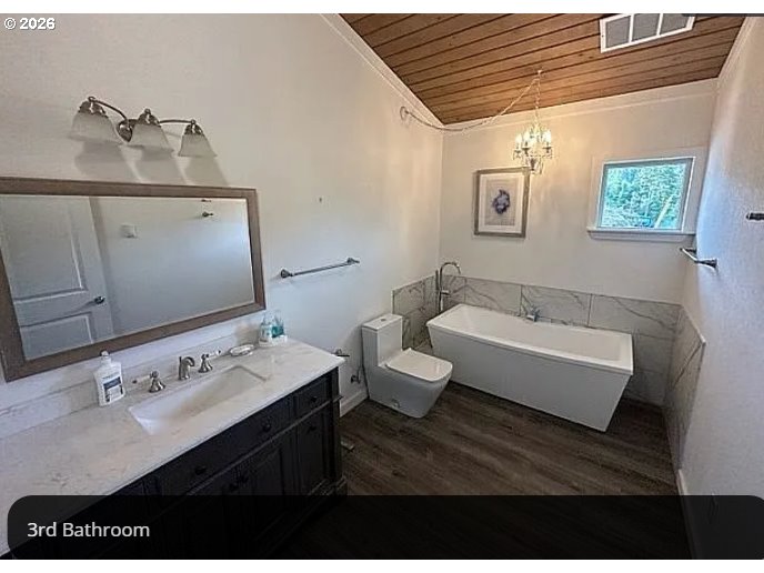 94475 Golf Course Lane North Bend, OR 97459 - Photo 15 of 45 a bathroom with a sink and a mirror