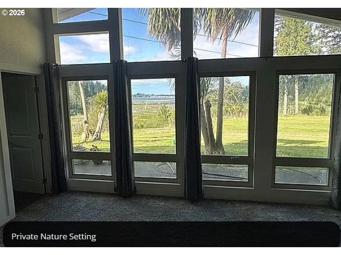 94475 Golf Course Lane North Bend, OR 97459 - Photo 18 of 45 a living room with a large window