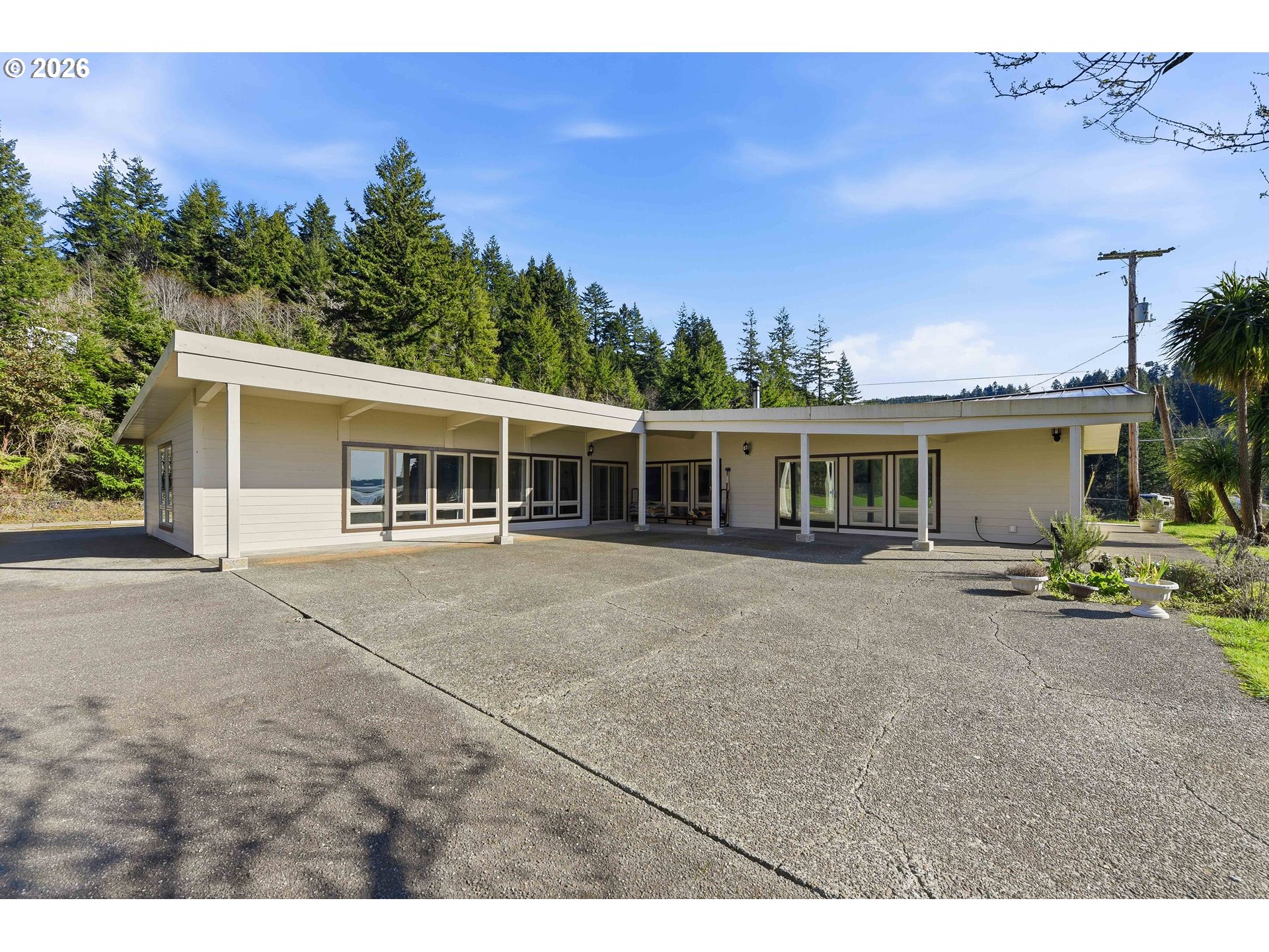 94475 Golf Course Lane North Bend, OR 97459 - Photo 37 of 45 a front view of a house with a garden