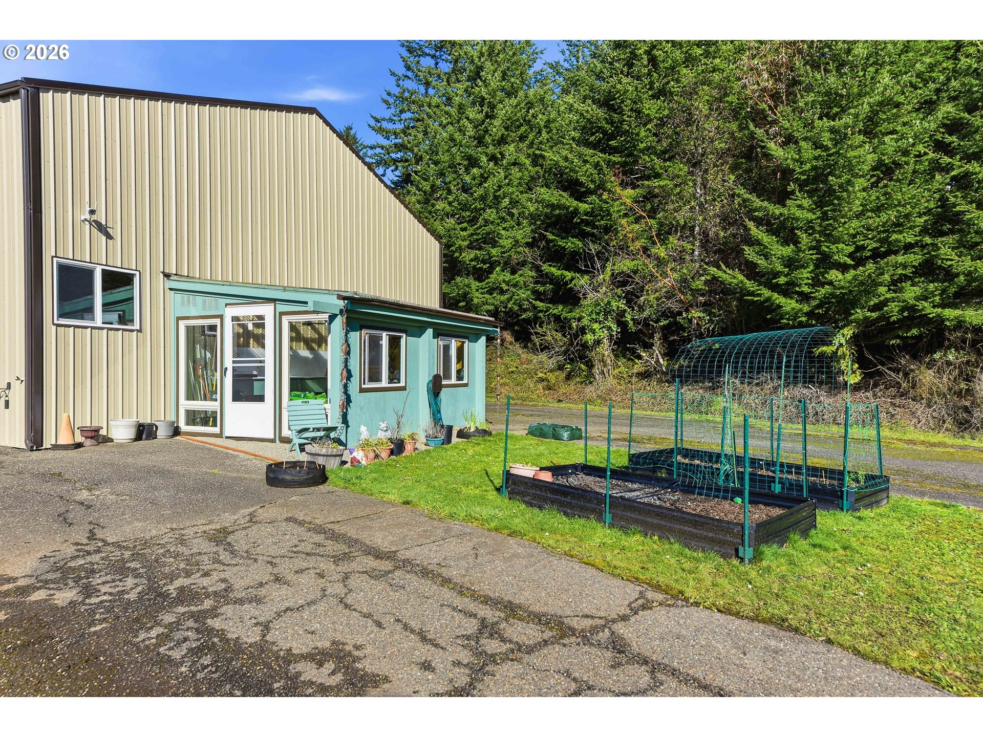 94475 Golf Course Lane North Bend, OR 97459 - Photo 40 of 45 a view of a house with backyard and trees