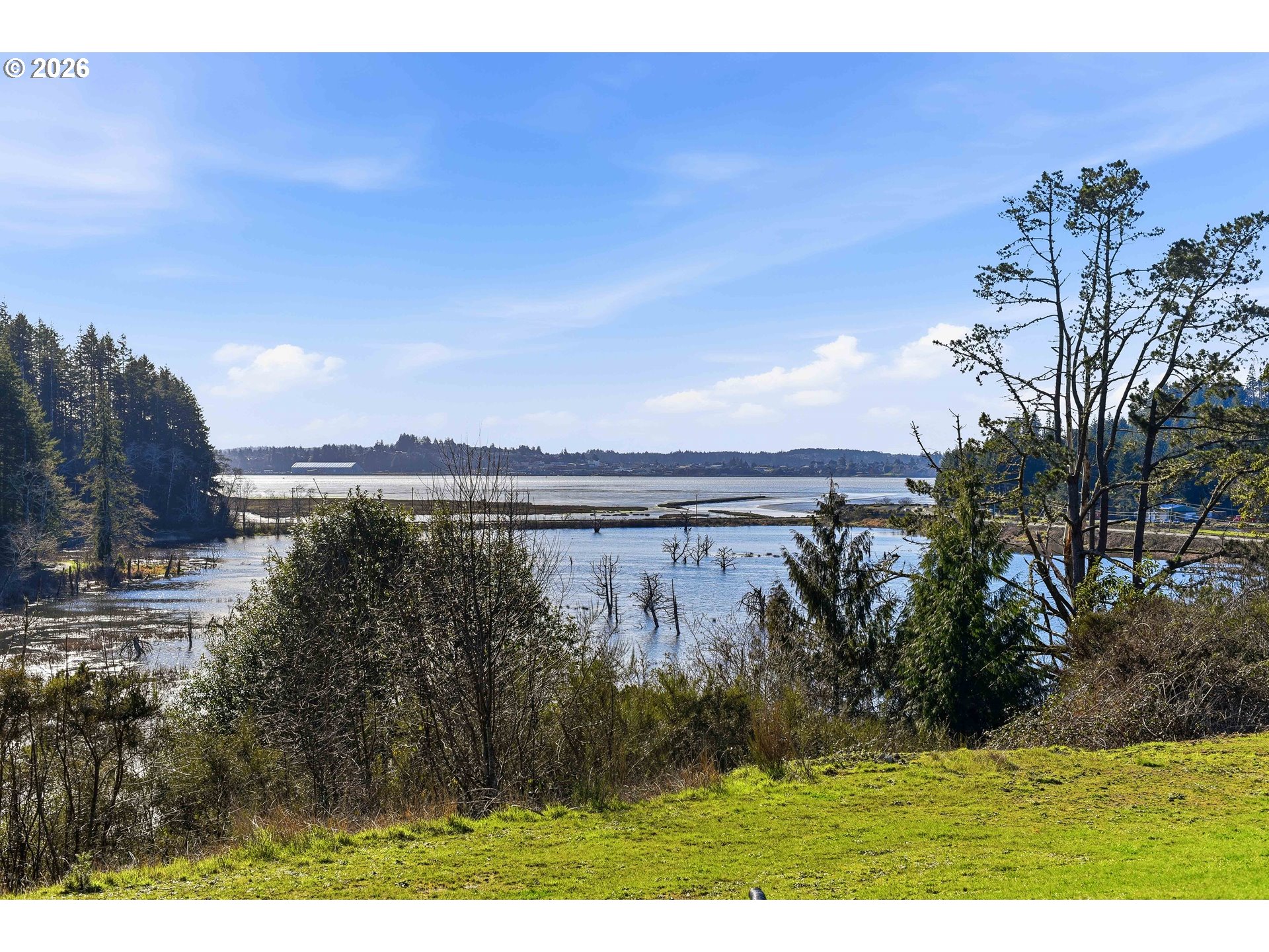 94475 Golf Course Lane North Bend, OR 97459 - Photo 43 of 45 a view of a lake with a yard