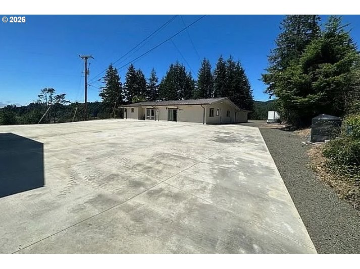 94475 Golf Course Lane North Bend, OR 97459 - Photo 6 of 45 a view of outdoor space with trees