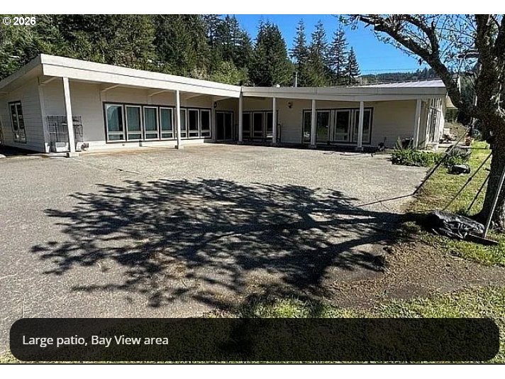 94475 Golf Course Lane North Bend, OR 97459 - Photo 7 of 45 a view of a house with a yard