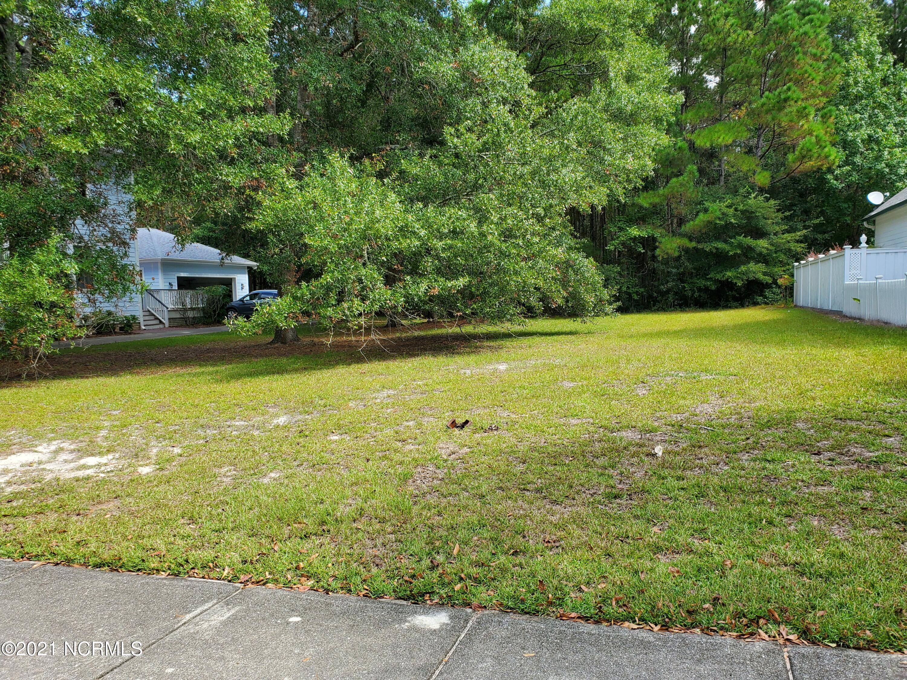 9148 East Bramshill Road Southwest Calabash, NC 28467 - Photo 1 of 10 Level with Trees