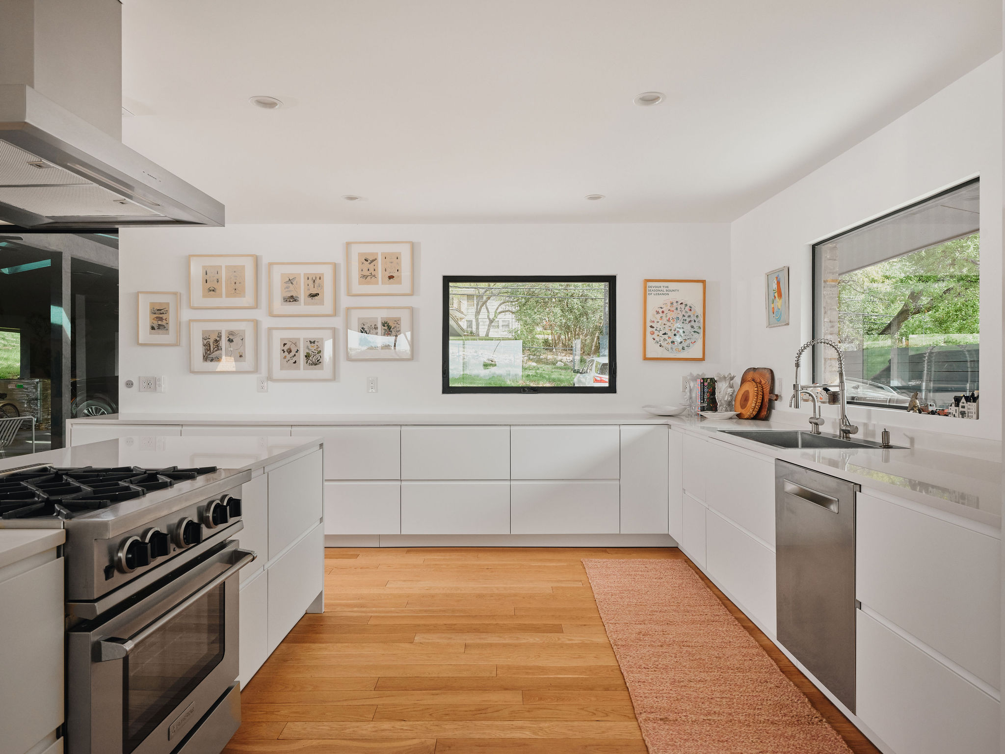 Undisclosed Address Austin, TX 78731 - Photo 10 of 26 Culinary delights await in this modern kitchen with ample counter space and natural illumination.