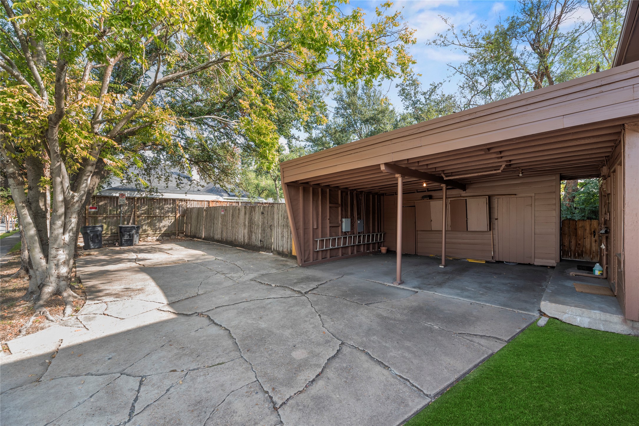 3930 Law Street, Unit 2 Houston, TX 77005 - Photo 15 of 16 a view of a house with a yard and garage