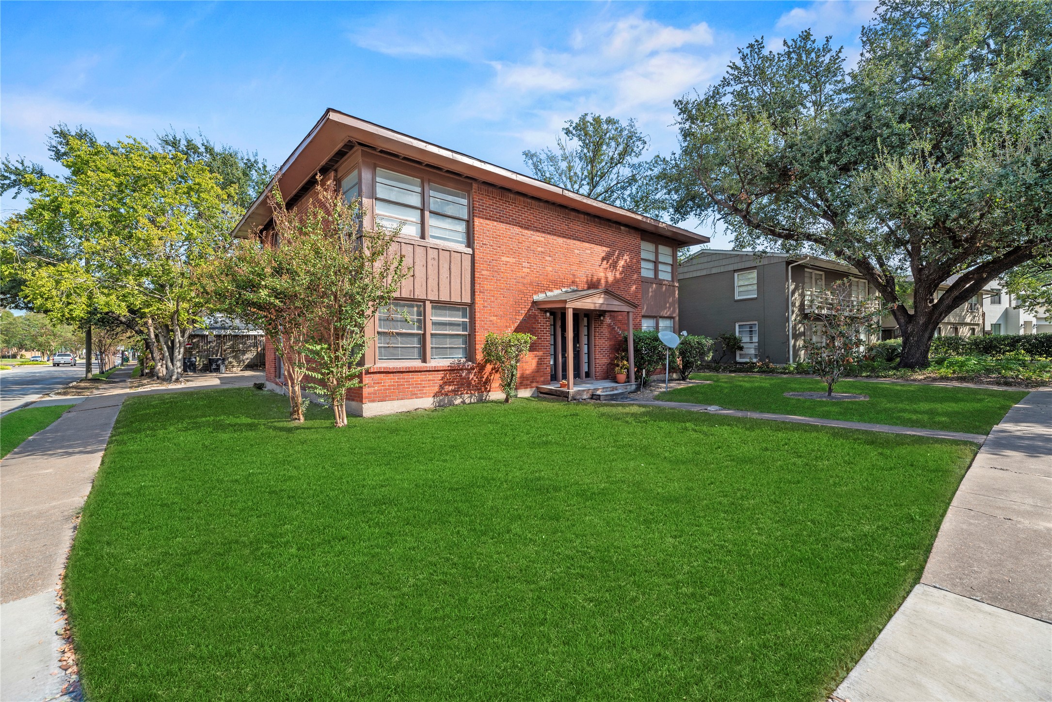 3930 Law Street, Unit 2 Houston, TX 77005 - Photo 16 of 16 a front view of a house with garden