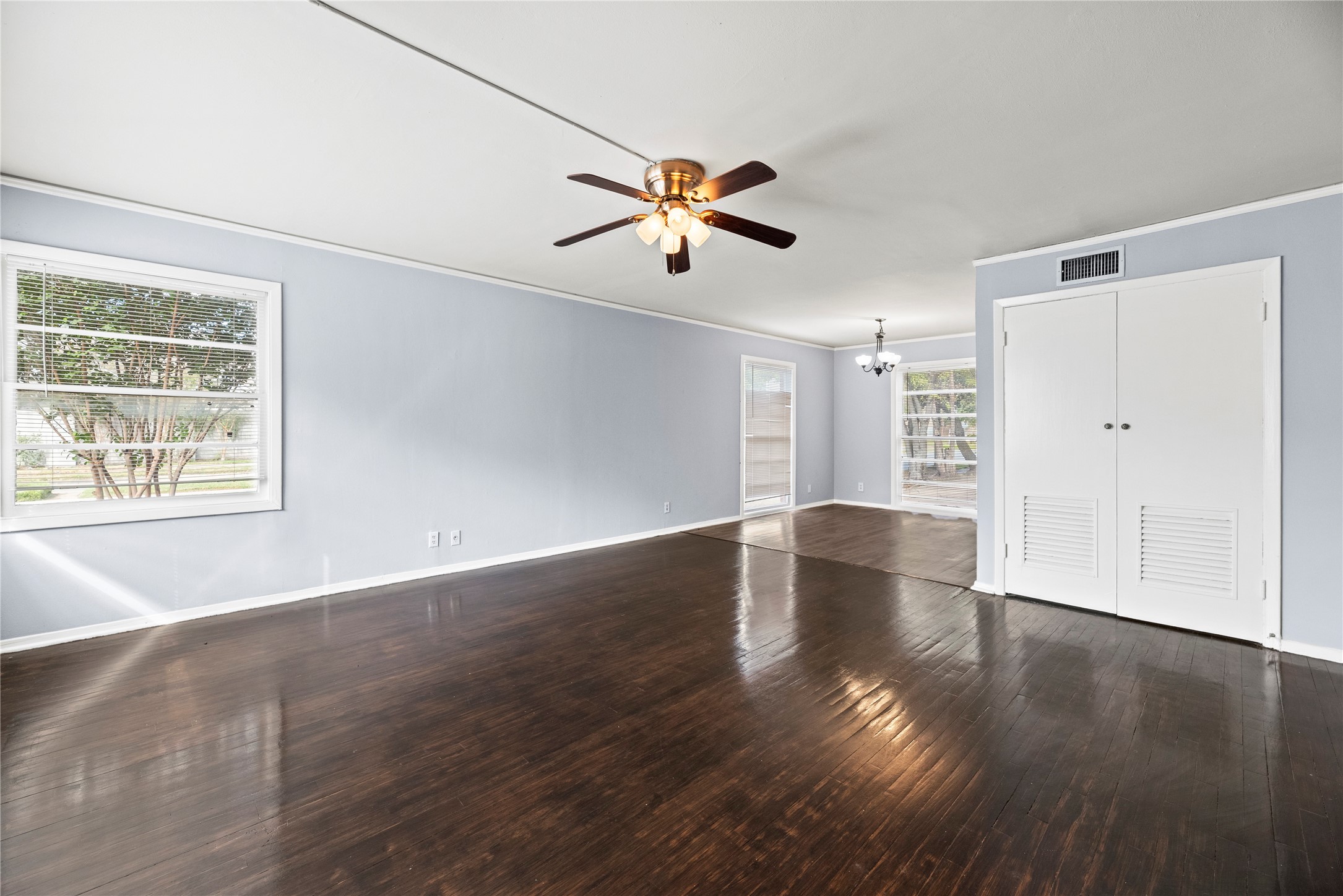 3930 Law Street, Unit 2 Houston, TX 77005 - Photo 5 of 16 a view of empty room with wooden floor and fan
