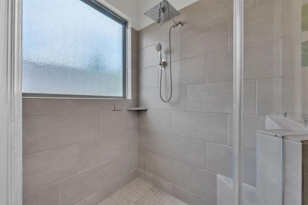 228 Palo Duro Bend Rhome, TX 76078 - Photo 20 of 35 a bathroom with a glass shower door