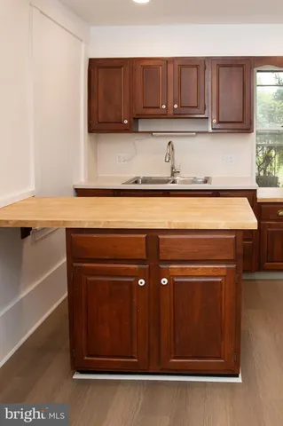 a kitchen with a cabinets and window