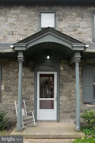 a front view of a house with parking space