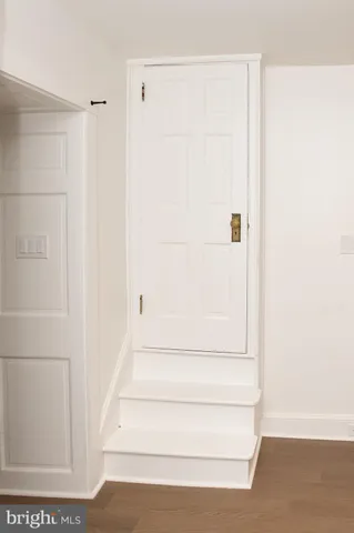 a view of staircase with white walls