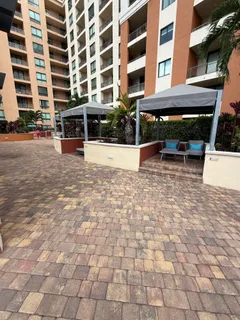 a view of a brick house with many windows