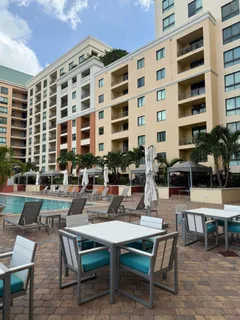 a view of swimming pool with outdoor seating