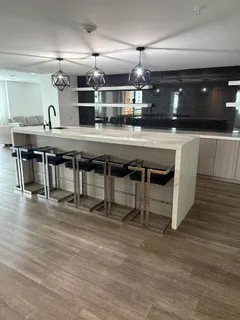 a black white and white kitchen with a black white and white countertops