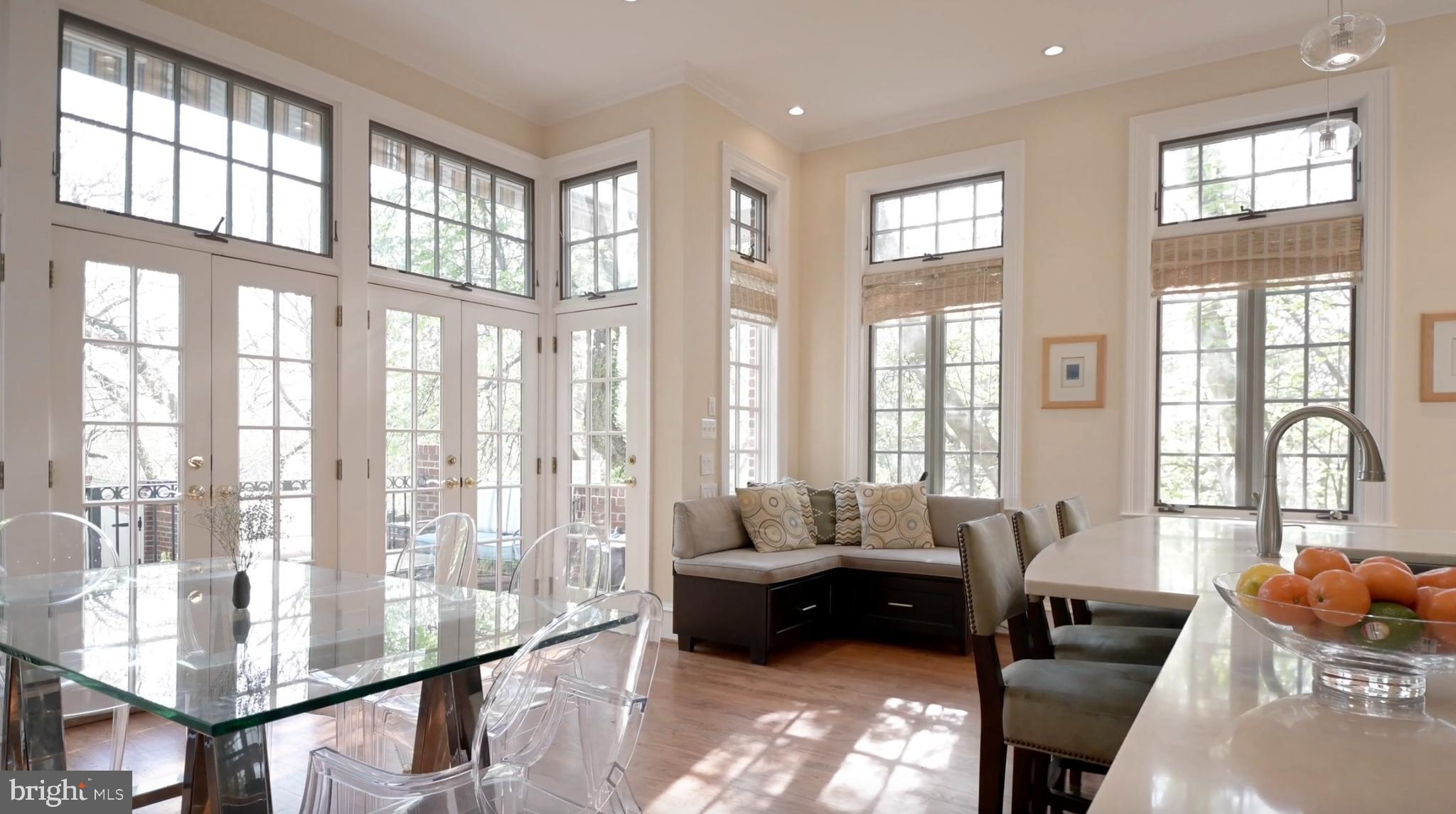 2238 Q Street Northwest Washington, DC 20008 - Photo 12 of 35 a living room with furniture and a floor to ceiling windows