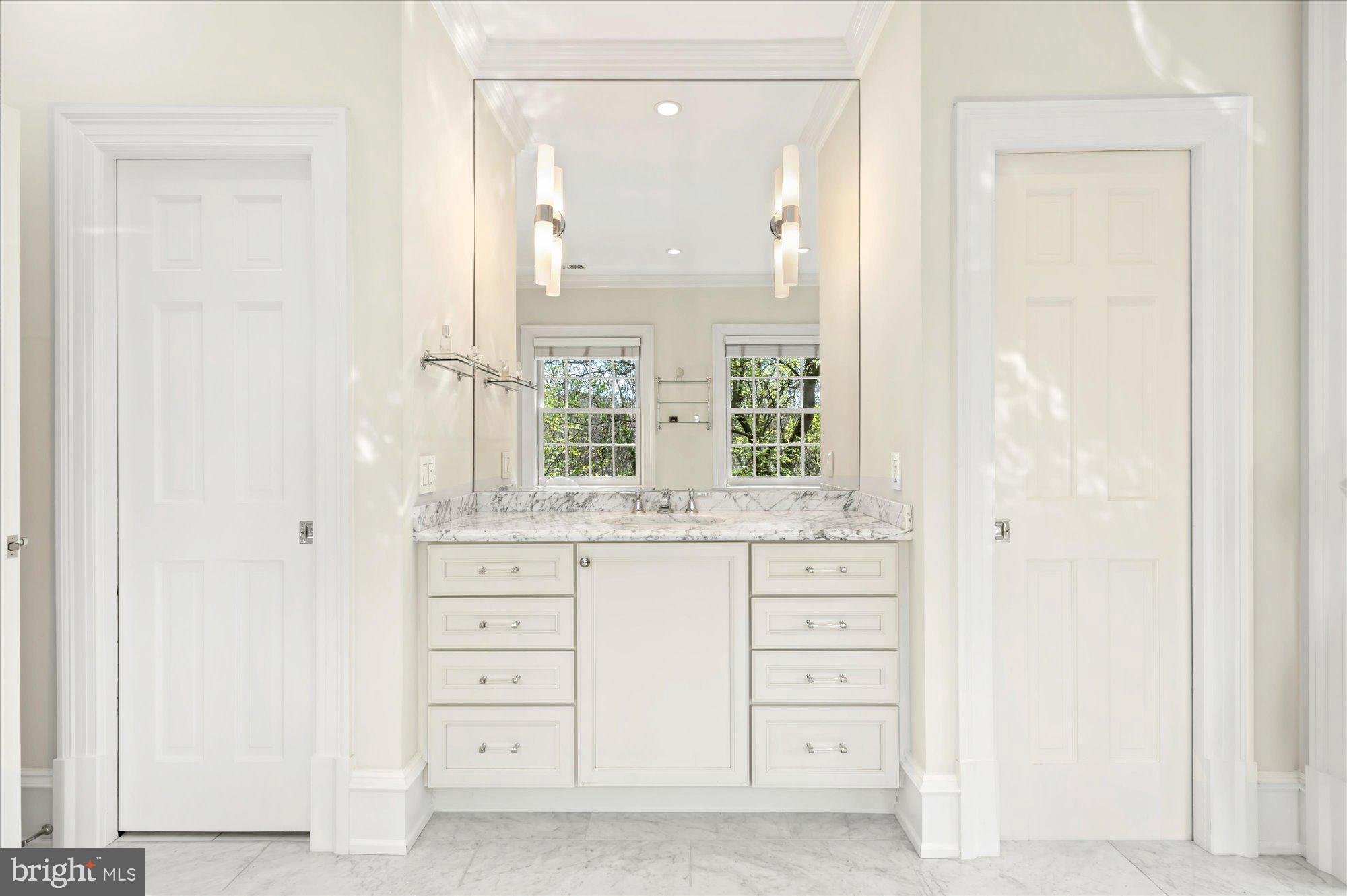 2238 Q Street Northwest Washington, DC 20008 - Photo 22 of 35 an empty room with windows and cabinet