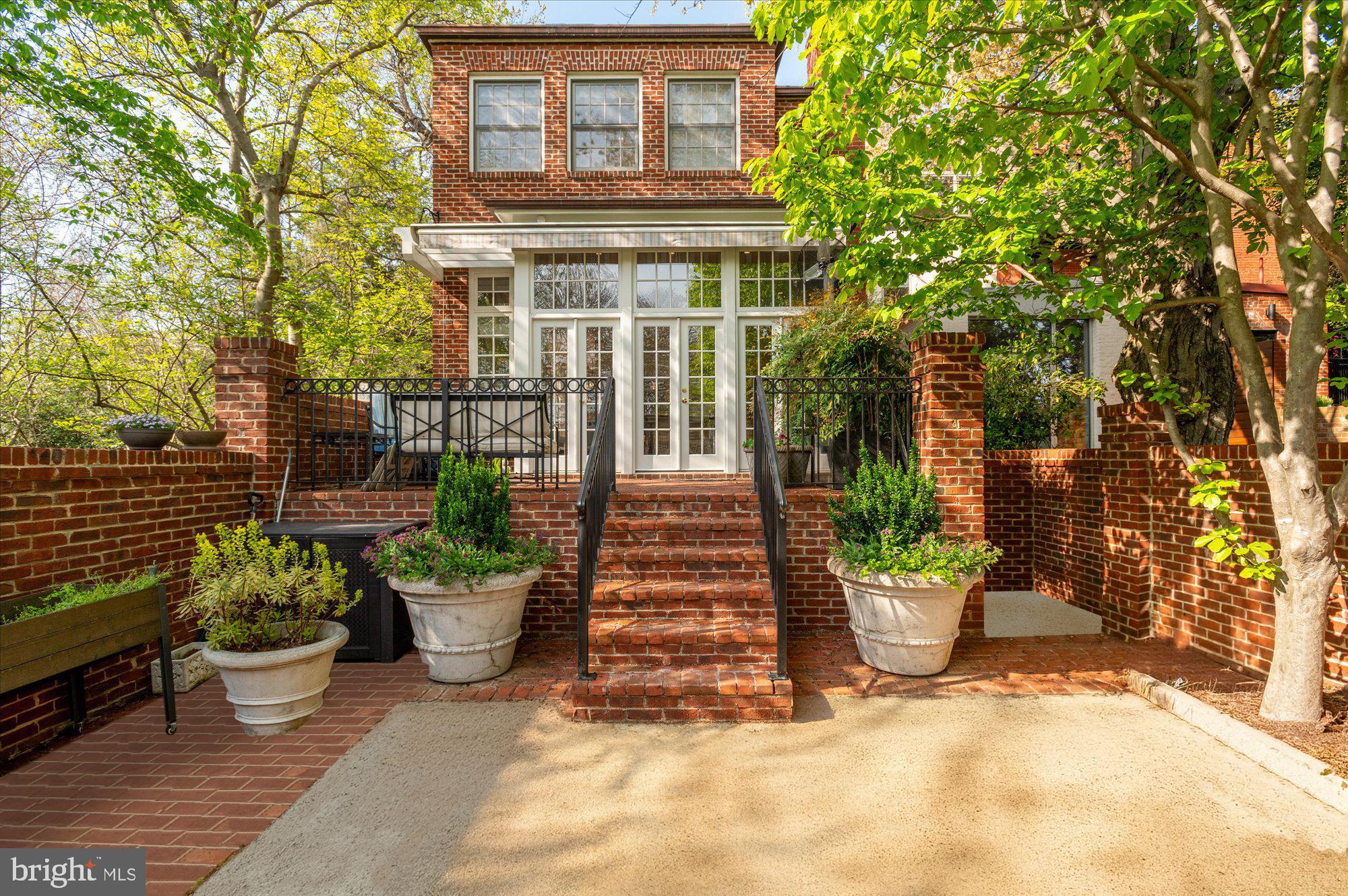 2238 Q Street Northwest Washington, DC 20008 - Photo 33 of 35 a front view of a house with a garden