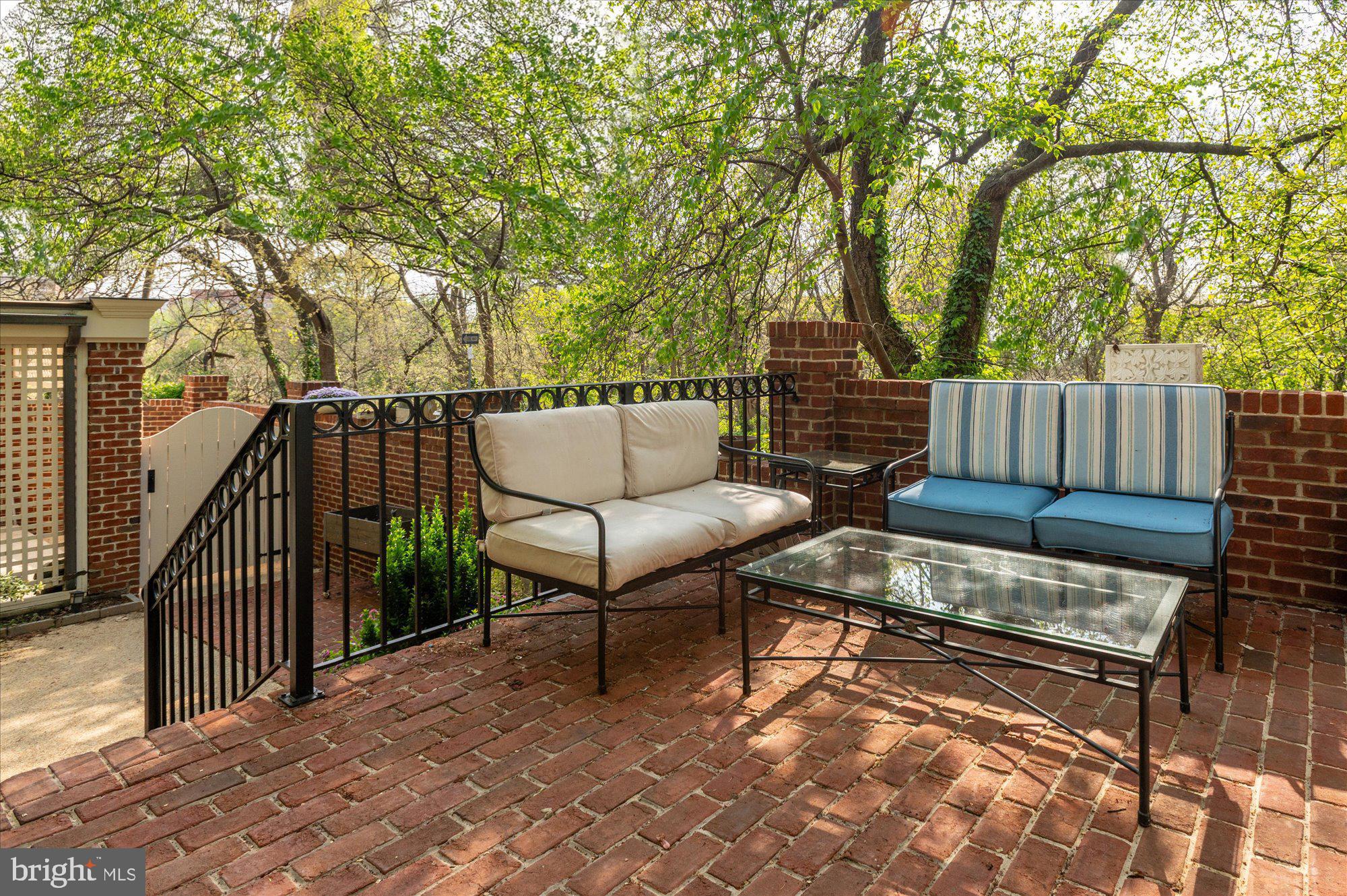 2238 Q Street Northwest Washington, DC 20008 - Photo 34 of 35 a view of a chairs and tables in the back yard of the house