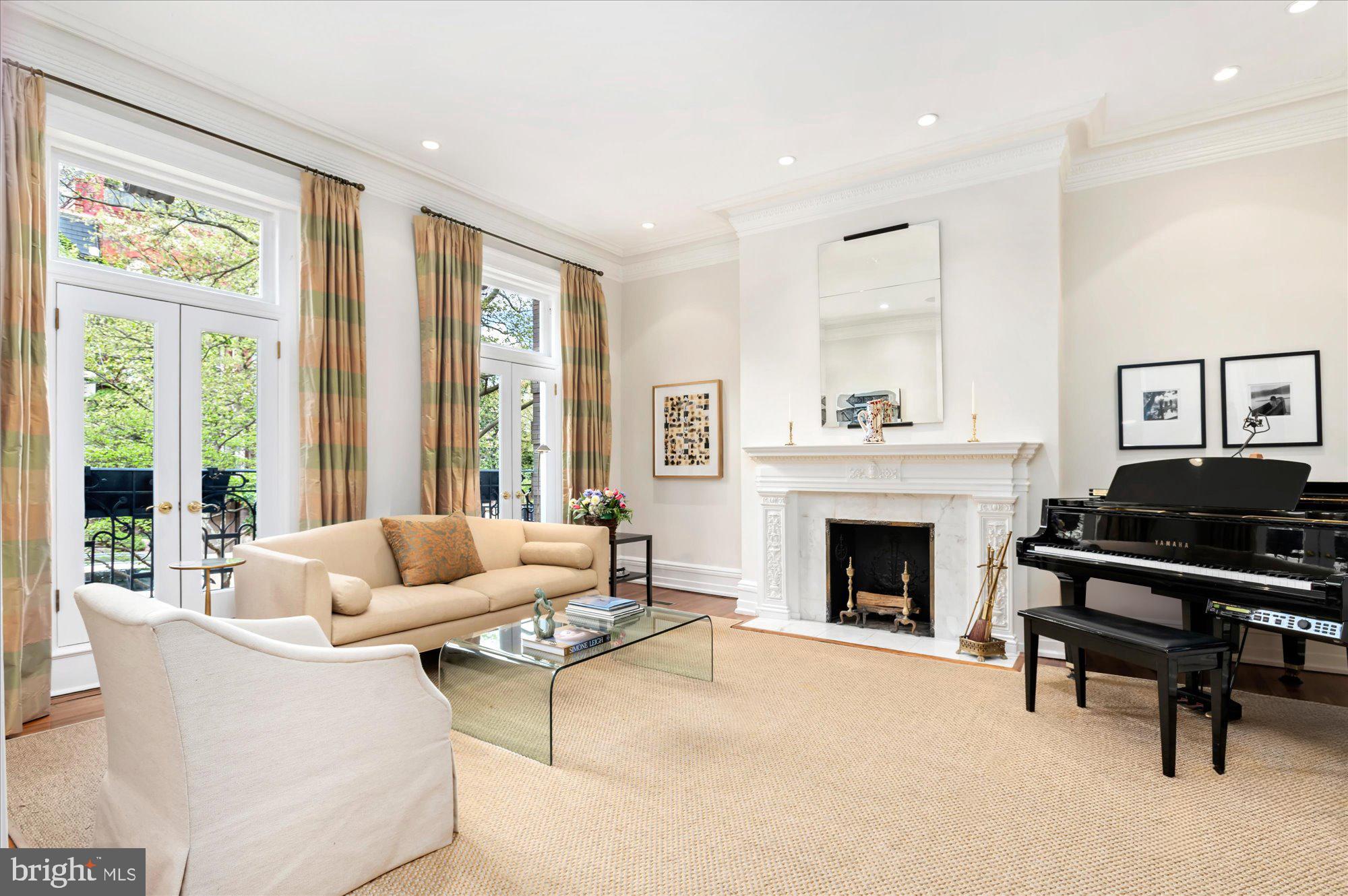 2238 Q Street Northwest Washington, DC 20008 - Photo 4 of 35 a living room with furniture and a fireplace