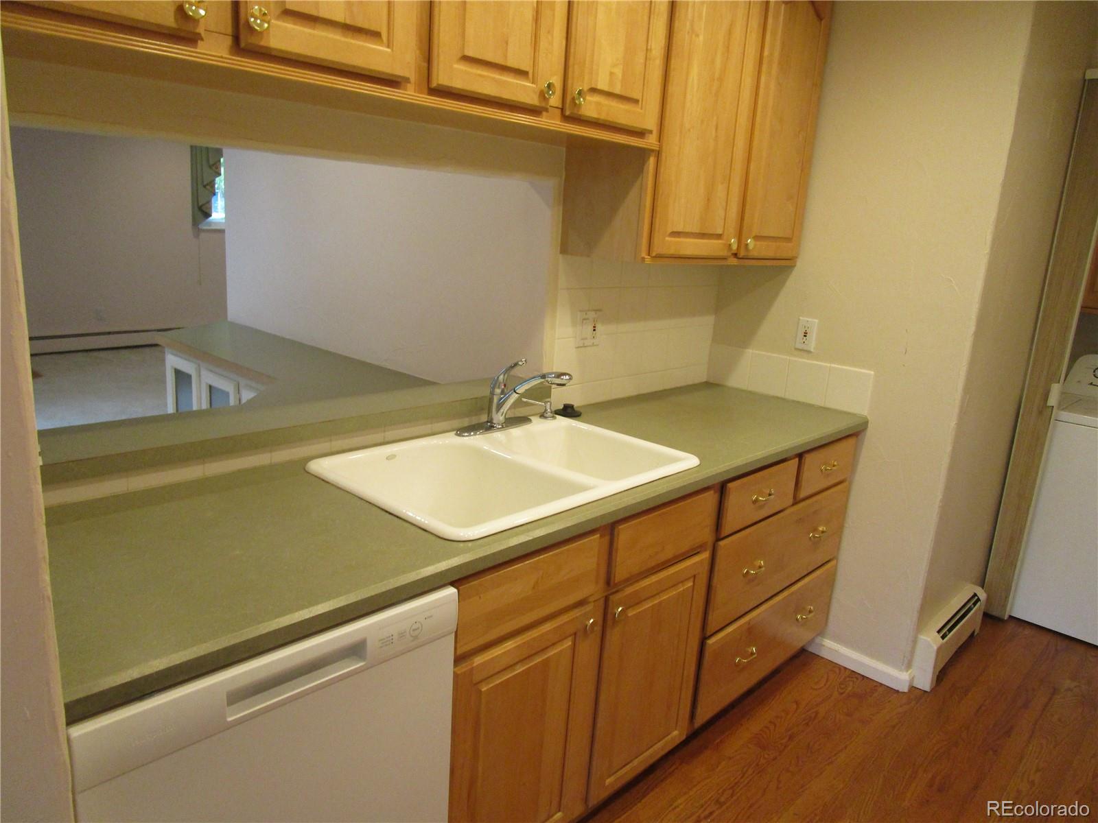 4 Nome Way, Unit A Aurora, CO 80012 - Photo 11 of 22 a bathroom with a sink and a mirror
