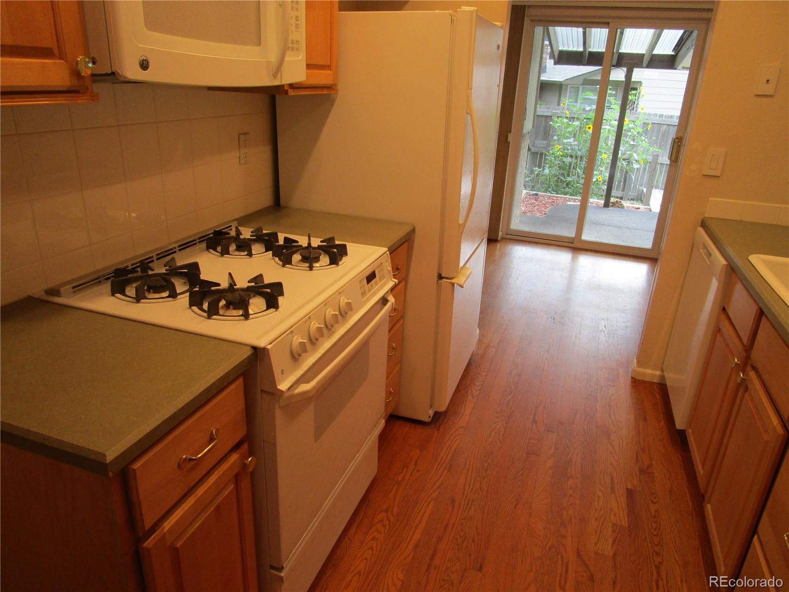 4 Nome Way, Unit A Aurora, CO 80012 - Photo 13 of 22 storage and utility room with wooden floor