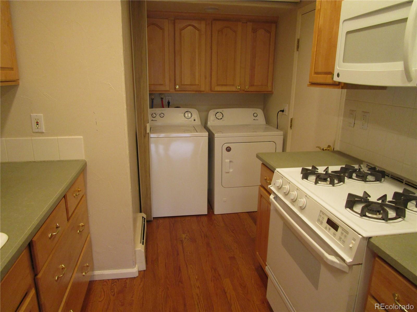 4 Nome Way, Unit A Aurora, CO 80012 - Photo 14 of 22 a view of a storage and utility room with washer and dryer