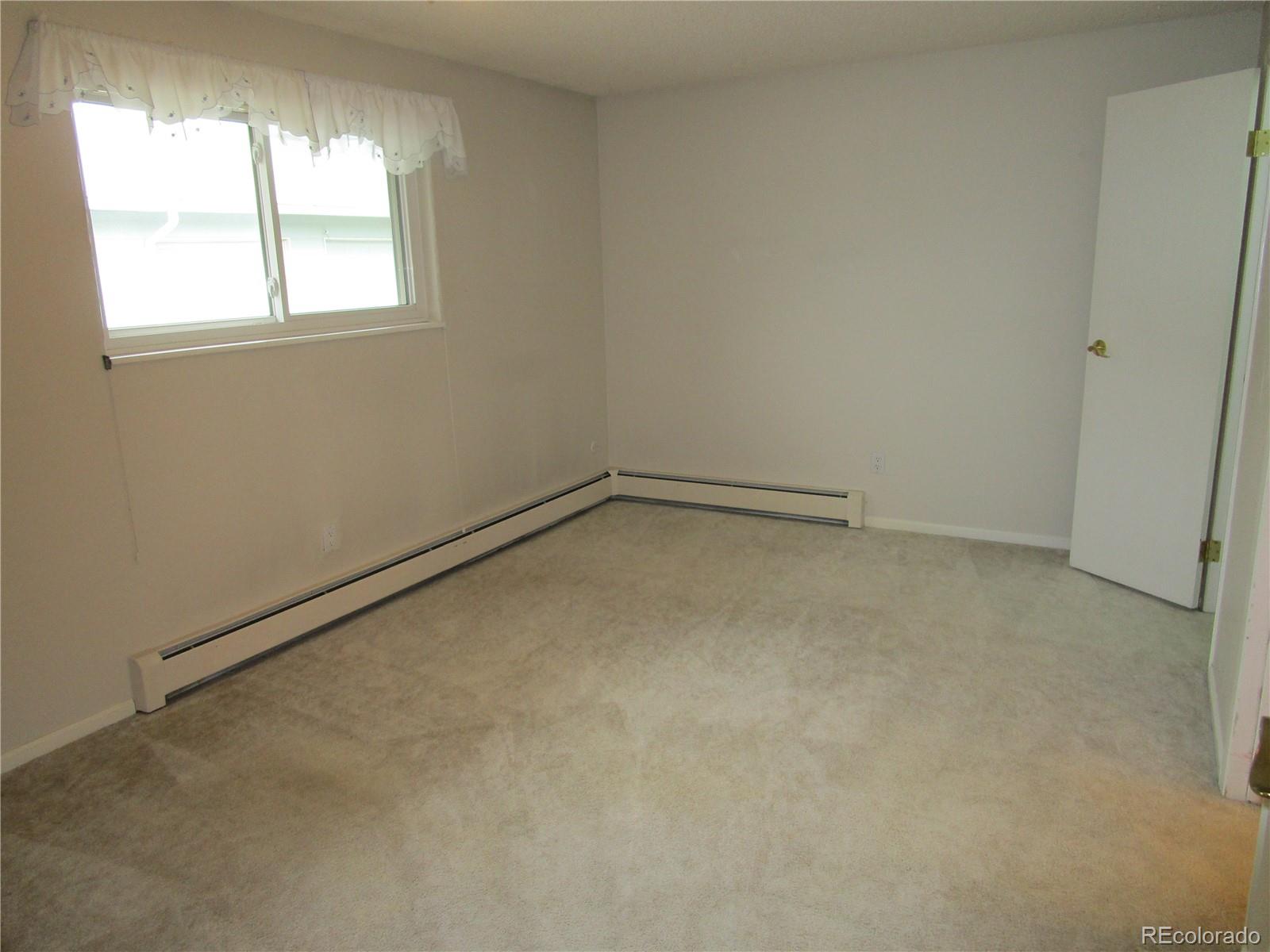 4 Nome Way, Unit A Aurora, CO 80012 - Photo 18 of 22 an empty room with a window