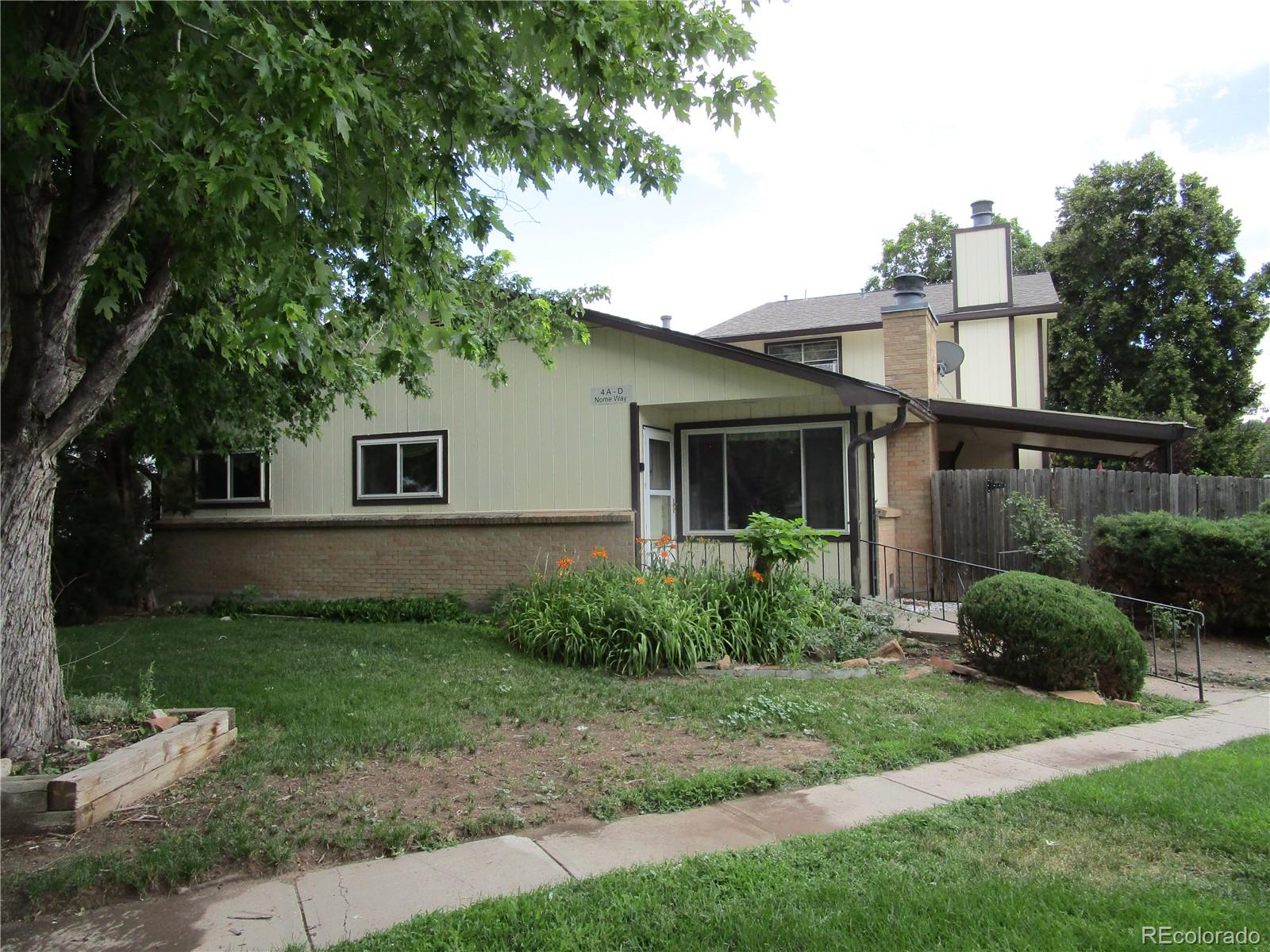 4 Nome Way, Unit A Aurora, CO 80012 - Photo 2 of 22 a view of a house with a yard