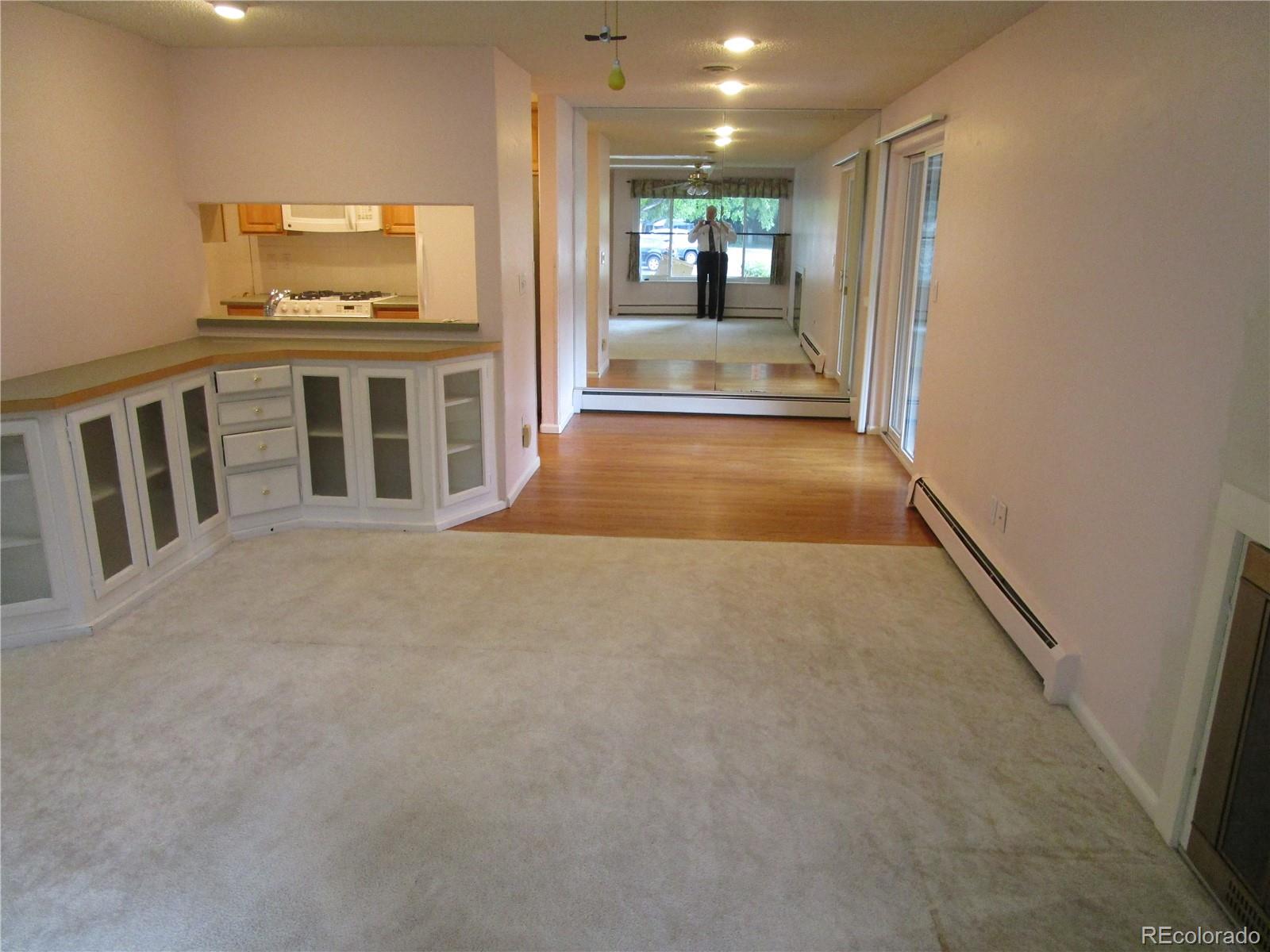 4 Nome Way, Unit A Aurora, CO 80012 - Photo 7 of 22 a view of livingroom with kitchen and furniture