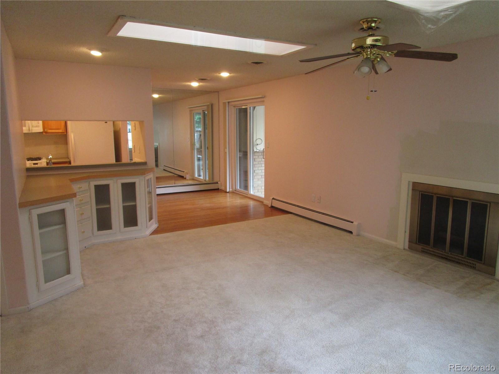 4 Nome Way, Unit A Aurora, CO 80012 - Photo 9 of 22 a view of a kitchen with a sink and a refrigerator