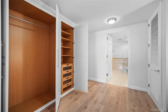 a spacious bathroom with a double vanity sink mirror and toilet