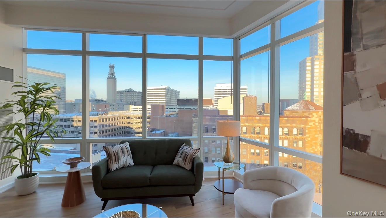 1 Renaissance Square, Unit 10E White Plains, NY 10601 - Photo 6 of 27 a living room with furniture and a potted plant
