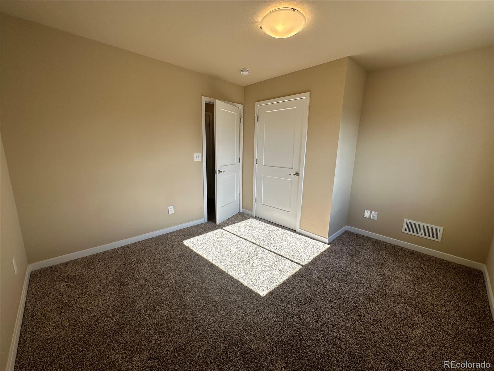 4213 Date Street Colorado Springs, CO 80917 - Photo 17 of 20 an empty room with windows