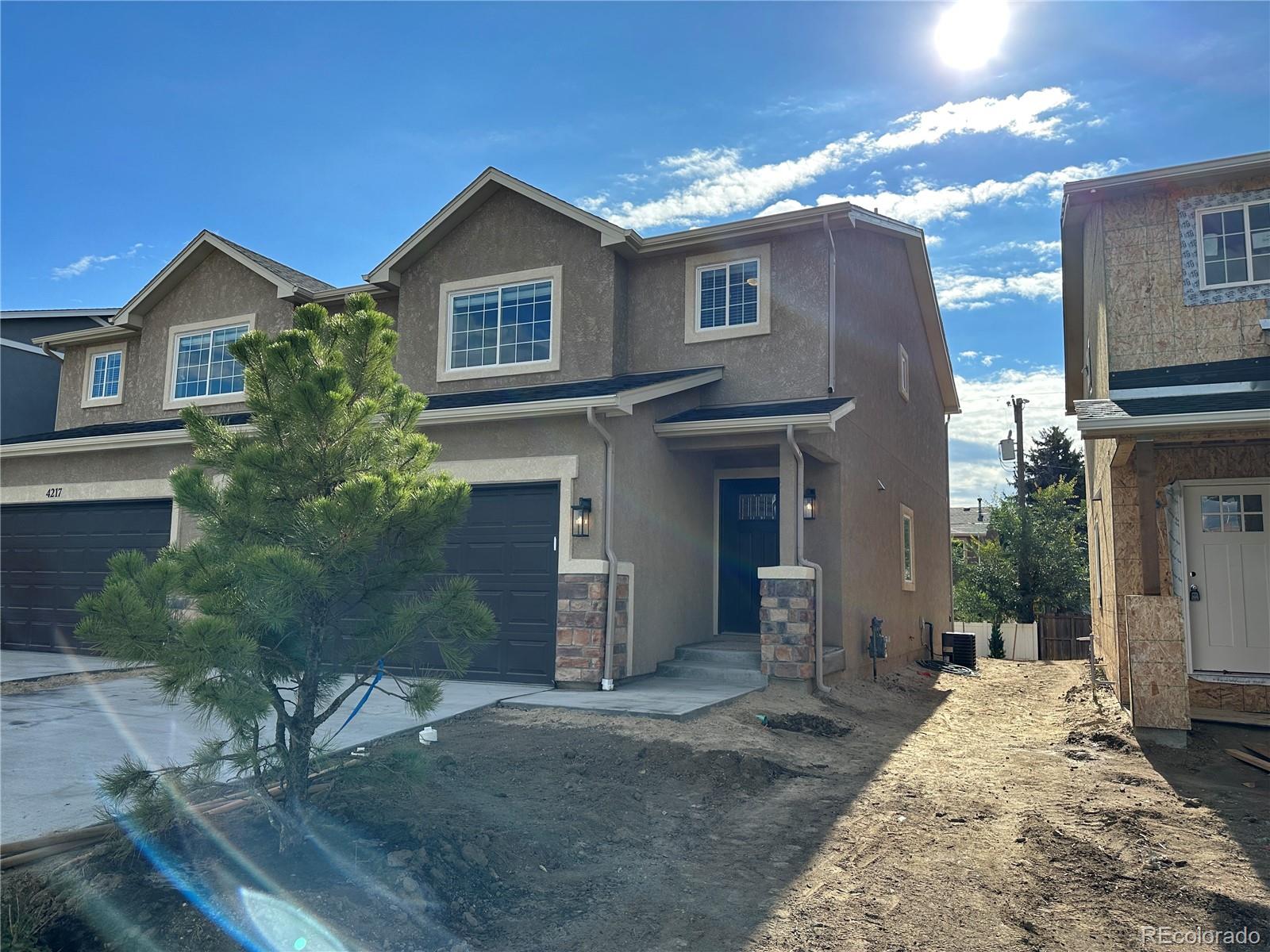 4213 Date Street Colorado Springs, CO 80917 - Photo 2 of 20 a view of a house with a yard