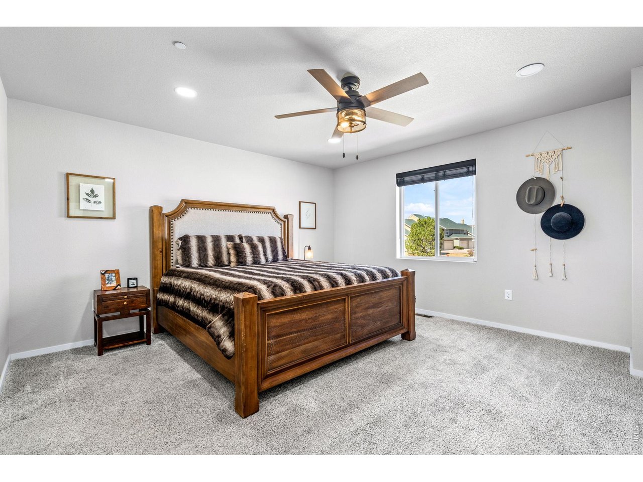 6609 West 4th Street Road, Unit 1 Greeley, CO 80634 - Photo 11 of 23 a bedroom with a bed and window