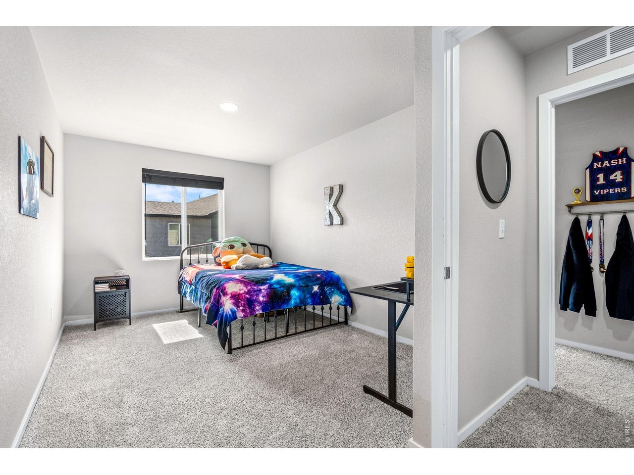 6609 West 4th Street Road, Unit 1 Greeley, CO 80634 - Photo 18 of 23 a bedroom with furniture and a window