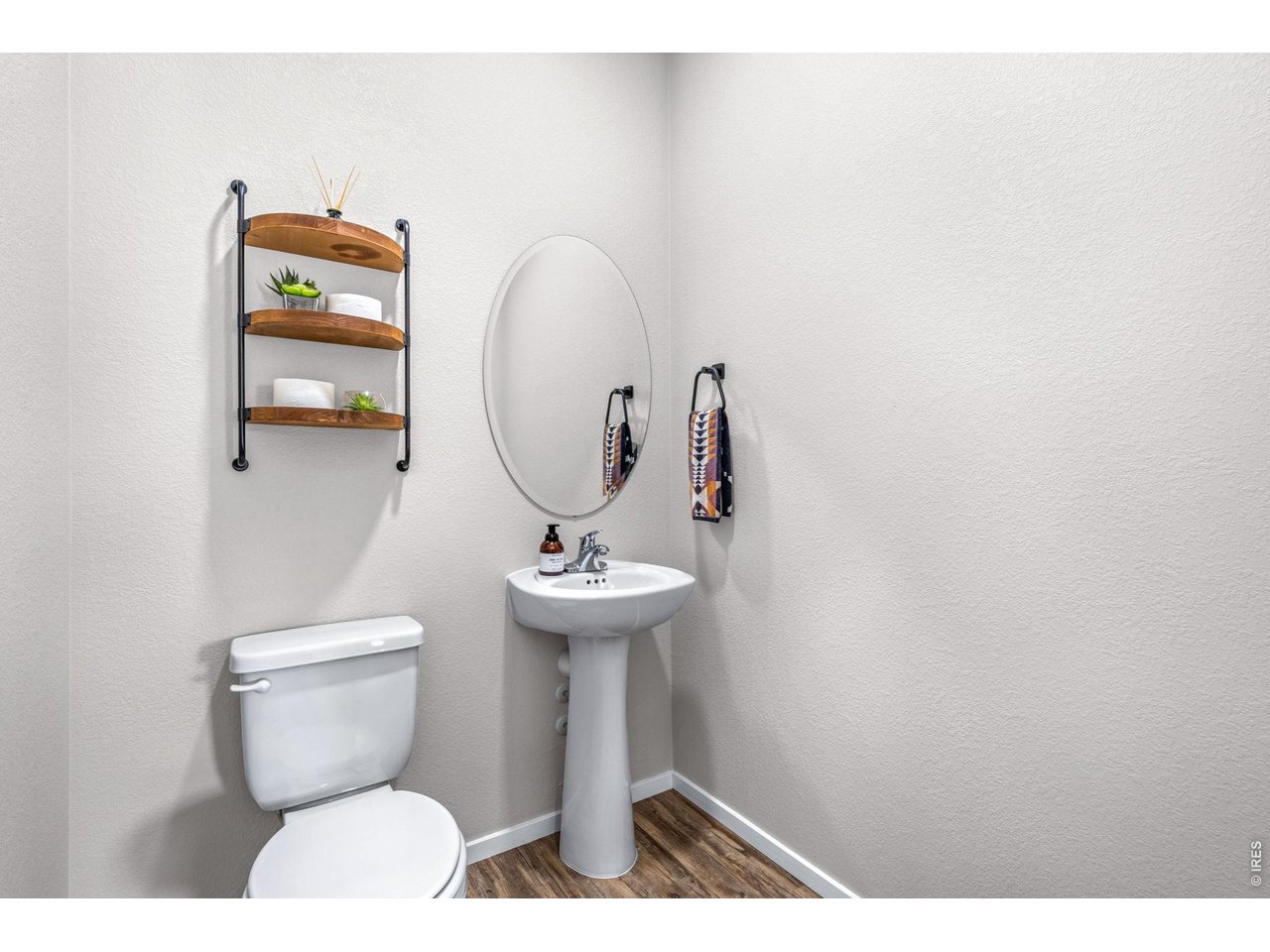 6609 West 4th Street Road, Unit 1 Greeley, CO 80634 - Photo 9 of 23 a bathroom with a toilet sink and mirror