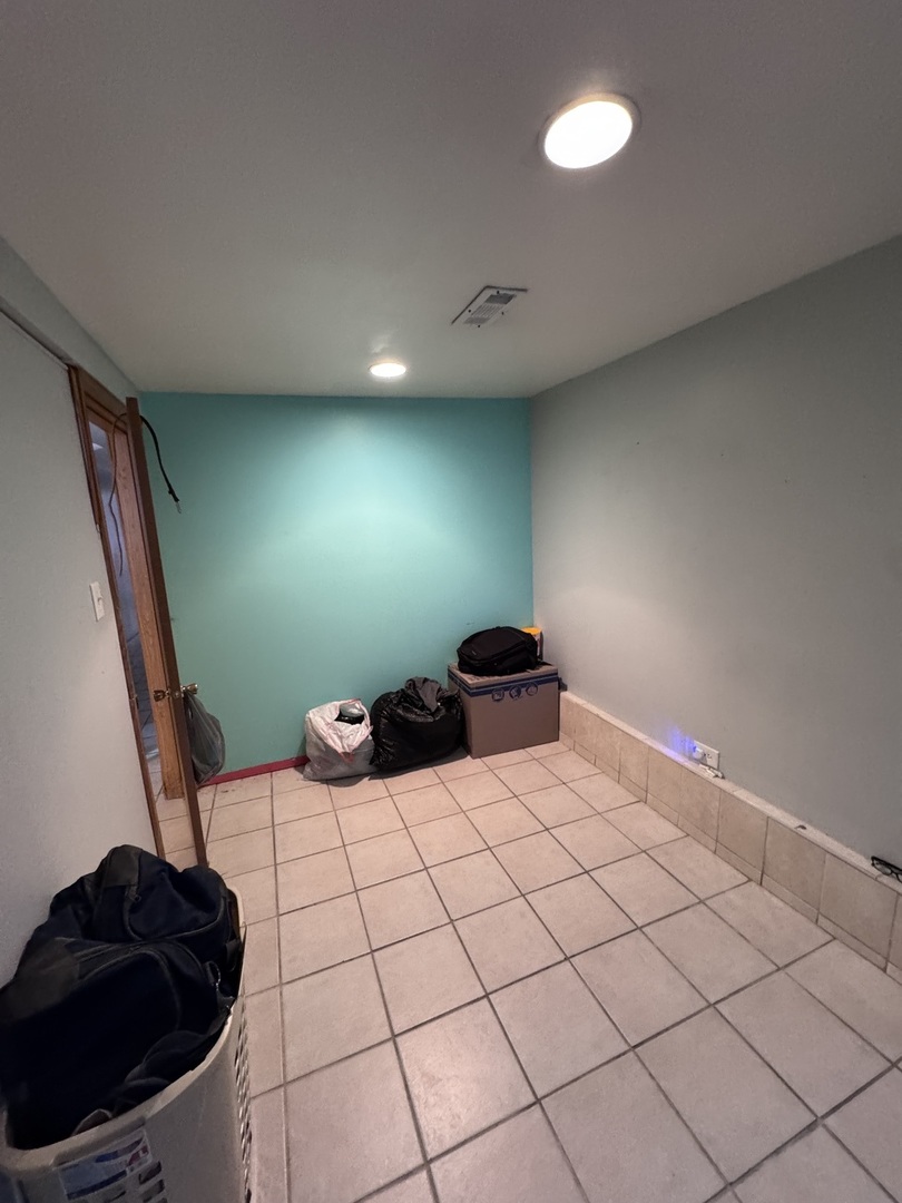 1940 North Pulaski Road Chicago, IL 60639 - Photo 21 of 33 a bathroom with a sink and a mirror