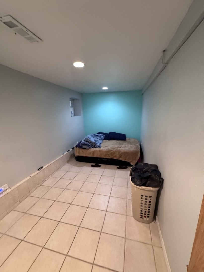 1940 North Pulaski Road Chicago, IL 60639 - Photo 22 of 33 a kitchen with a sink and cabinets