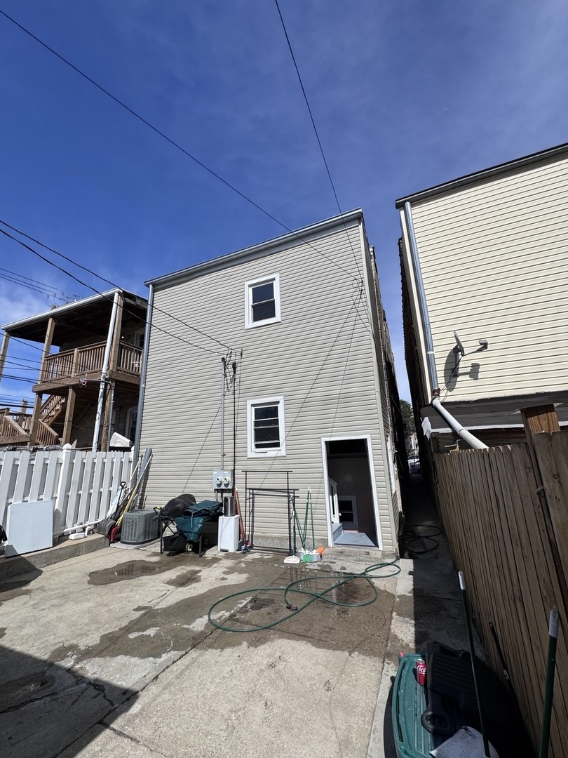 1940 North Pulaski Road Chicago, IL 60639 - Photo 3 of 33 a front view of a house with a garage