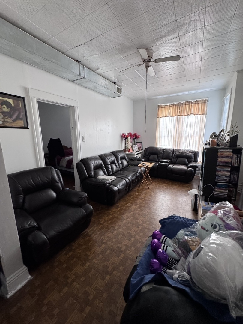 1940 North Pulaski Road Chicago, IL 60639 - Photo 8 of 33 a living room with furniture window and a table