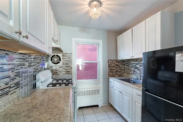 a kitchen with a stove and a microwave