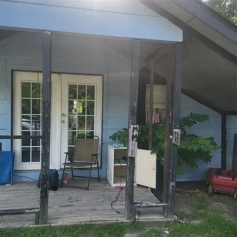 a view of a bench in front of house